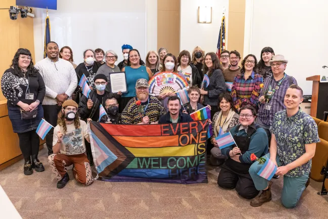 Board of Commissioners and invited guests pose for a photo 