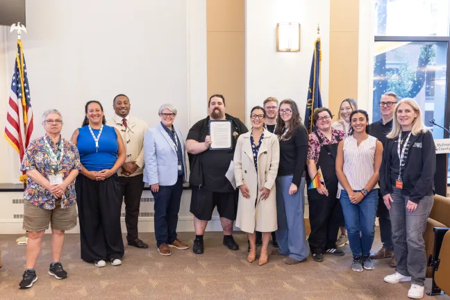 Community members and County leaders celebrate the official Disability Pride Month Proclamation signing. 