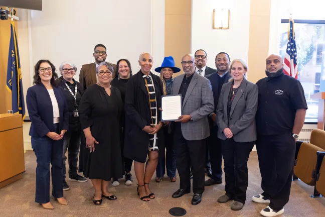 The Board and community members pose for a photo with the proclamation designating September 2026 as the 25th Celebration of Pastoral and Community Leadership of Bishop C. T. Wells in Multnomah County.