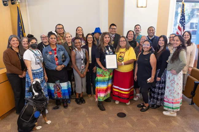 The Board, County staff and community members pose for a photo with the proclamation designating Oct. 12, 2026, as Indigenous Peoples’ Day in Multnomah County.