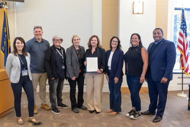 The Board and County staff pose for a photo with the National Cybersecurity Awareness Month proclamation.