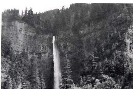 Sheriff's officer and patrol car parked opposite Multnomah Falls.