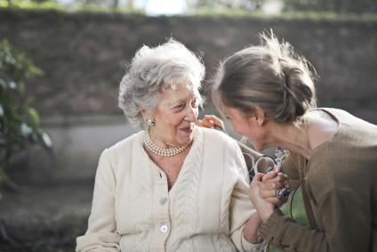 daughter greets mother in adult care home