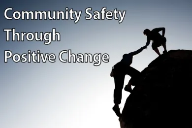 photo of one climber helping another- Community Safety Through Positive Change
