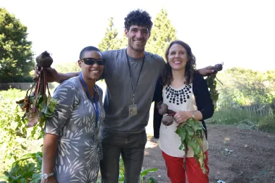 From left: Restorative justice manager Sidney Morgan; crew leader Sidney Walters and Chair Kafoury pose with radishes plucked fresh from the Hands of Wonder garden