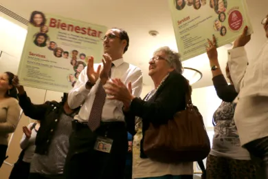 Nabil Zaghloul of Multnomah County's Bienestar de la Familia program celebrates at Thursday's meeting. Bienestar de la Familia connects members of the Latino community with mental health, social services and more.