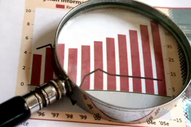 Chart and magnifying glass
