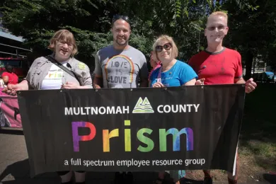 Multnomah County Chief Diversity and Equity Officer Ben Duncan (second from left)  poses with members of Prism, a Multnomah County Employee Resource Group focused on ensuring LGBTQ equity and inclusion. 
