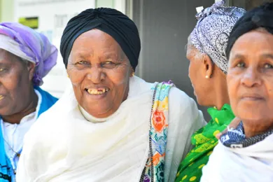 From left: Momena Ogato; Semenu Michael; Medhen Gebredmedin; and Munit Kassa visit IRCO's Africa House every Thursday to socialize and enjoy the weekly meal service. 
