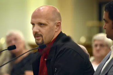 Timothy Phipps shares his story of recovery with the Board of Commissioners on Thursday.