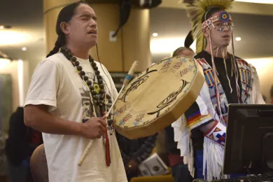 Fish Martinez performs a hand drum song in honor of Indigenous People’s Day at Thursday’s board meeting. 