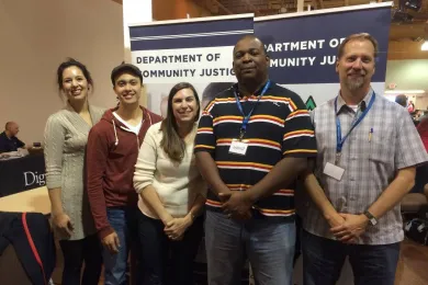 Commissioner McKeel and DCJ Staff pose for a photo