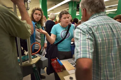 Citizen discusses air quality monitoring with DEQ staff.