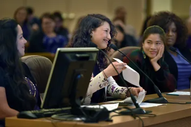 BRAVE initiative member Carina Guzman tells commissioners about her struggle to find affordable birth control