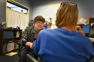 Health Assessment and Treatment team Nurse Margaret Rogers meets with a recently released offender at the Assessment and Referral Center