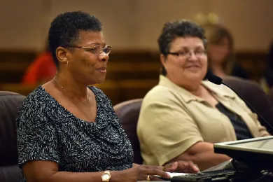 Jan Starnes (left) and Dolores Peters addressed the board in honor of Older Americans Month.