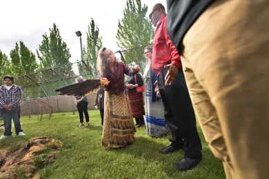 Juvenile Services interim director Truls Neal is smudged with sage as part of blessing ceremony for Juvenile Detention Ceremony.  