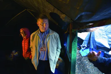 Epidemiologist Amy Zlot and Health Inspector Mike Christman inspect a homeless shelter in downtown Portland. 