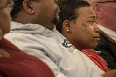 The brother of Larnell Bruce listens to people speak about being Black and Latino in Portland