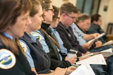Paramedics from American Medical Response listen to testimony at Board meeting.