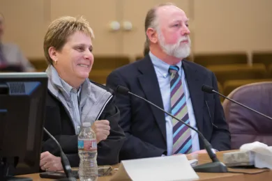 MCAS director Jackie Rose and Department of Community Services Director Kim Peoples speak before board 