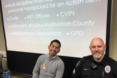 From left: Ricky Ruiz, of the City of Gresham, and Lt. Miller, of Gresham Police Department, at an East County Caring Community Open House in December 2016.