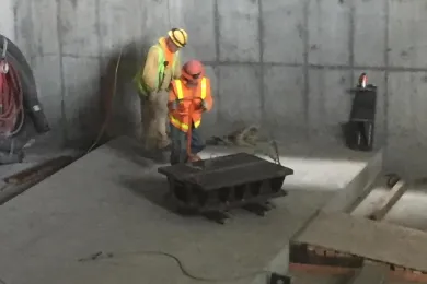 Contractor moves temporary live load shoe that will support Morrison Bridge lift span during repairs.