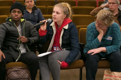 Emma Cooper, center, says schools need more — and more confidential — mental health services