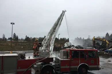 Portland Fire works to extinguish a salvage yard fire.
