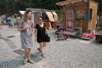 Commissioner Lori Stegmann, right, during a tour of Kenton Women's Village in August 2018.