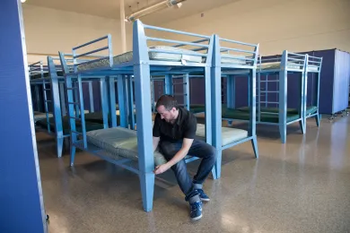 Matt Olguin of Transition Projects adjusts bunks at the Walnut Park shelter on Monday, Nov. 19, 2018.