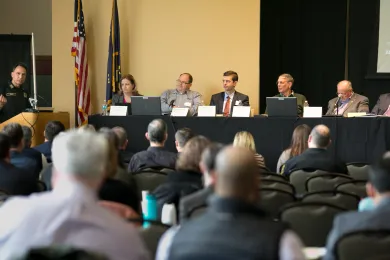 Sheriff Mike Reese, speaknig during a 2018 summit on opioids, says he ran for office in part to address addiction