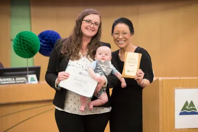 Sustainability Award winner Deputy District Attorney Anna Fuller (left) her son Peter and Commissioner Lori Stegmann