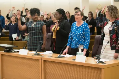 Lynn Smith-Stott, with the county's Mental Health and Addiction Services Division, asked people to stand and pledge support for reducing stigma