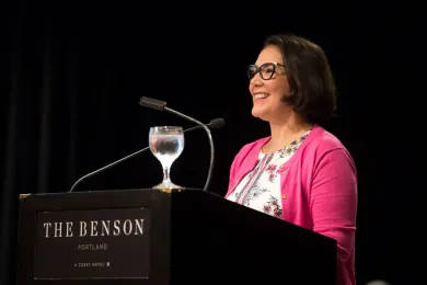 Commissioner Vega Pederson speaks at HMC luncheon