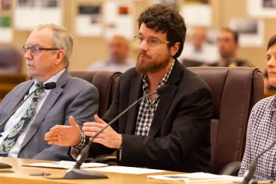 Justin Paterson with Hoffman Construction (center) explains how the firm is making the Central Courthouse a welcoming workplace.