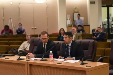 County Attorney Will Glasson, left, and Chief Financial Officer Eric Arellano brief the Board on the tourism taxes agreement Sept. 19, 2019.