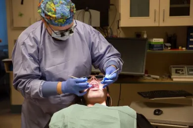 COURTESY OF MULTNOMAH COUNTY: Pictured, a patient is examined at a Multnomah County Department dental clinic. A new audit flagged concerns about turnover, continuity of care, and patient access. 