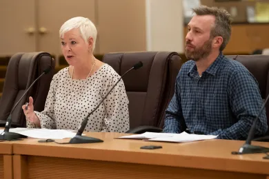 Environmental Health Director Jae Douglas, Ph.D., left, explains the fees associated with new food cart pod rules.