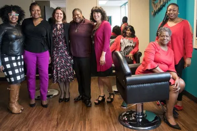 From left: Multnomah County's Ebony Clarke, Erika Preuitt, Chair Deborah Kafoury, Lakeesha Dumas, Commissioner Sharon Meieran, Regina Penny, Bonnie Johnson and Latoya Manlove pose for photo in Diane Wade House salon.