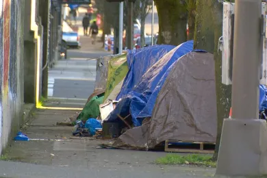 photo of tents on a street sidewalk