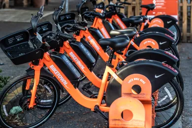 A row of the distinct orange bikes of Nike's Bike Town.