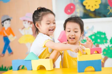 Two Preschoolers Building with Blocks
