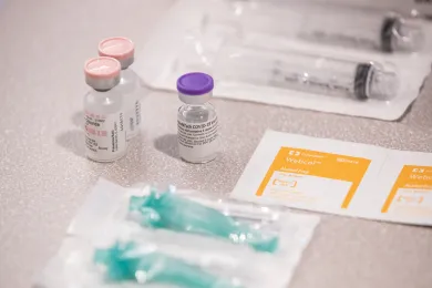 Vaccine vials and alcohol wipes at a recent County vaccine clinic .