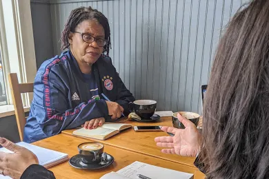 Annette Majekodunmi, a parent and community engagement supervisor at POIC + Rosemary Anderson High School works side by side with Tamika and other parents. 
