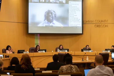 Dr. Matt Ross, adjunct professor at Portland State University, speaks to the Board of Commissioners about a student volunteer program for youth involved with the justice system.