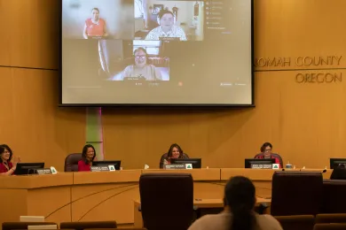 Board of Commissioners and three panelisits