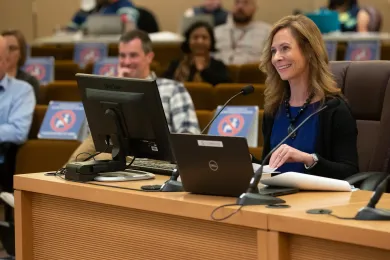 Budget Director Christian Elkin speaks to the Board.