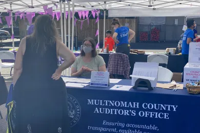 Auditor McGuirk talks with a constituent at a fall 2021 Rosewood Initiative event