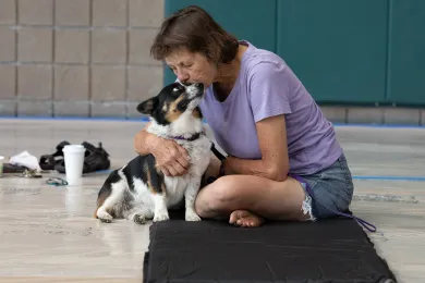 A guest and her dog at East Portland Community Center, July 26, 2022